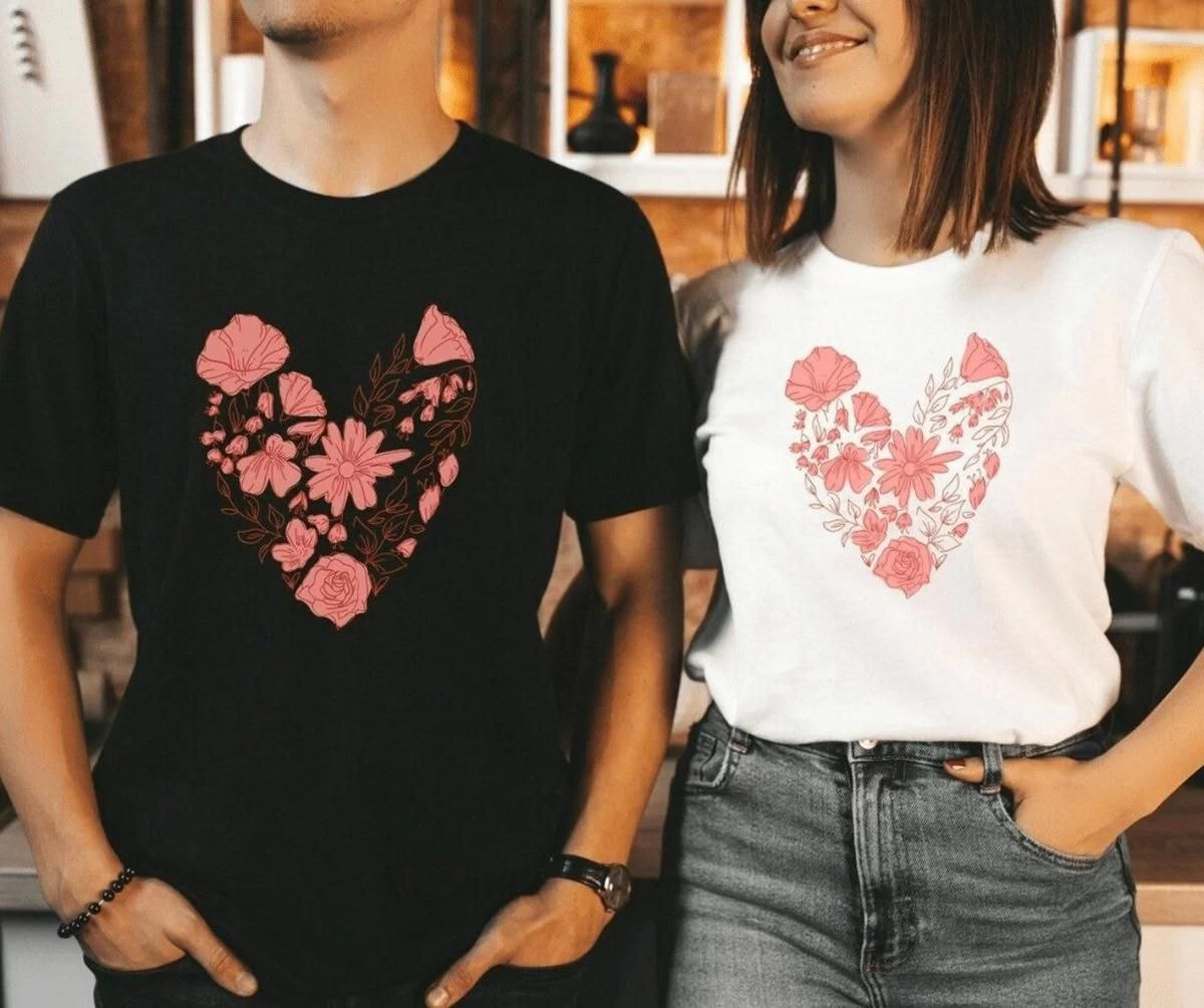 a man and woman wearing matching t-shirts