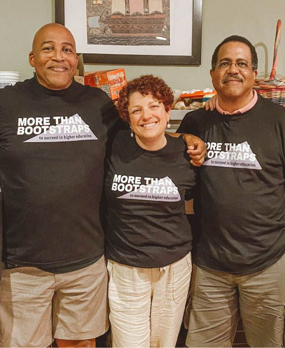 three people wearing matching black t-shirts
