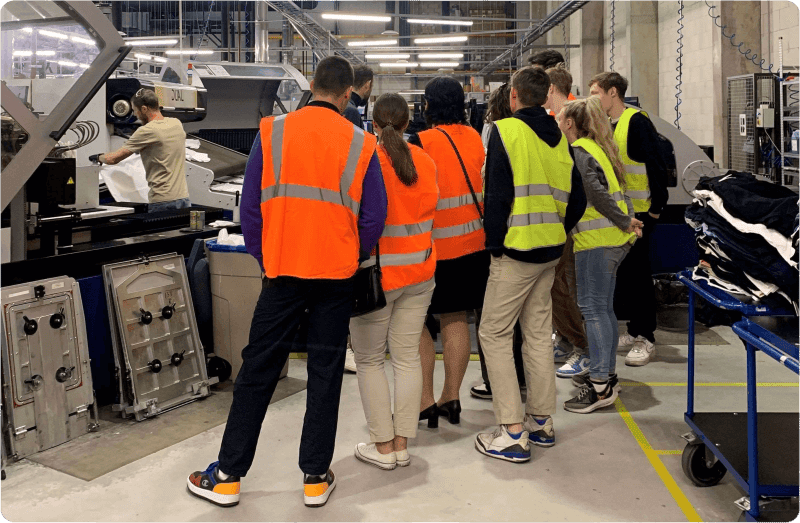 Students from Business 24h program visiting Printful facility