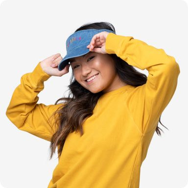 model in a yellow sweatshirt